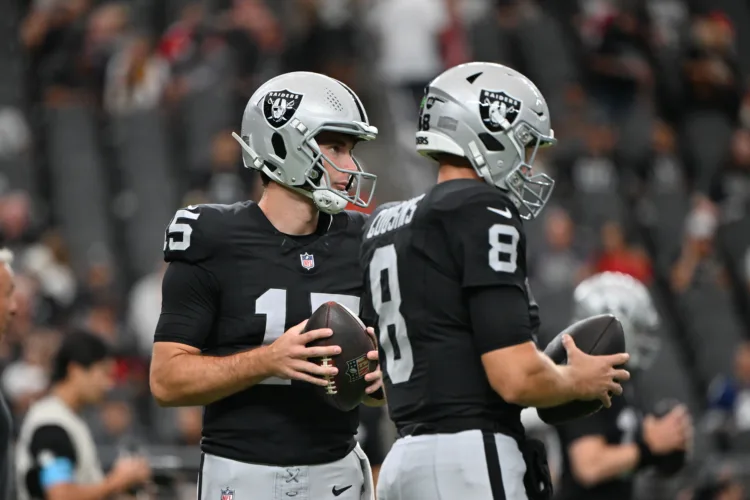 Raiders’ coach keeping quiet on his QB situation